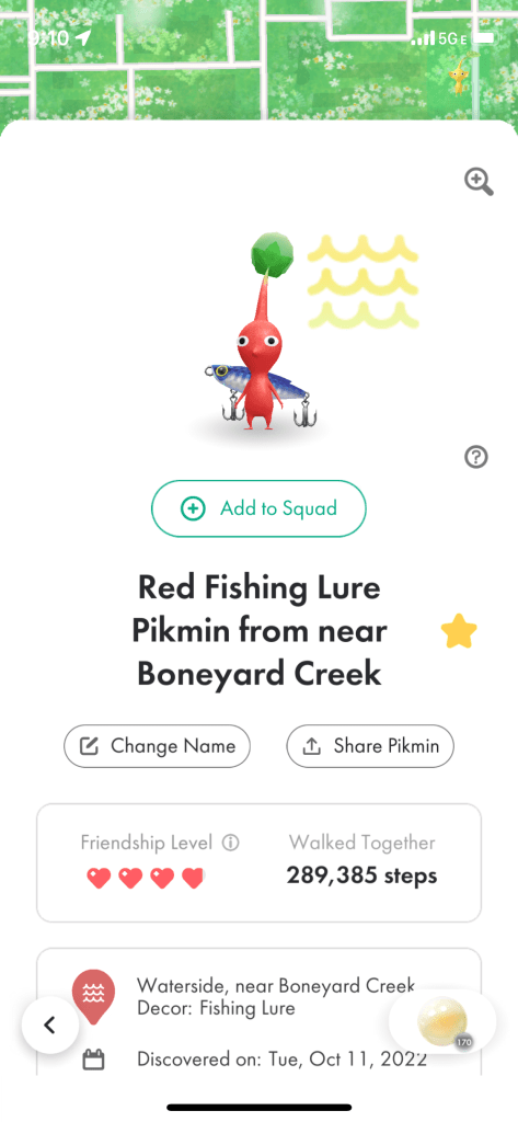 Red fishing lure Pikmin from near Boneyard Creek. It's a red pikmin with a blue fishing lure on its back. It's a waterside decor pikmin, which requires being near a body of water to find. 