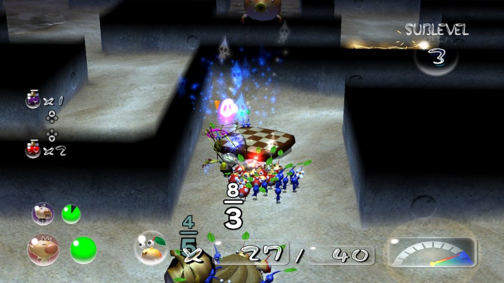 We are in a maze-like area with dark gray walls and a dark sandy floor. In the center is a chess board like cookie and 5 spirits floating away. 1 pink spirit indicating the enemy spider and 4 Pikmin. 
