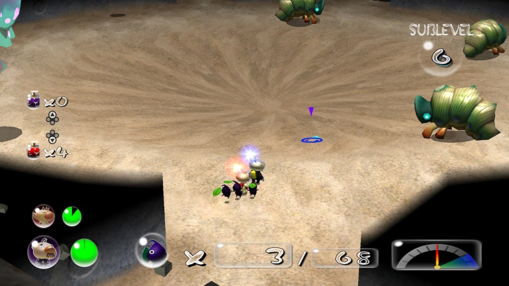 It's a sandy area with a circular pit that gently slopes downward in the center. There are three caterpillar looking enemies to the side. These guys shoot rocks. 