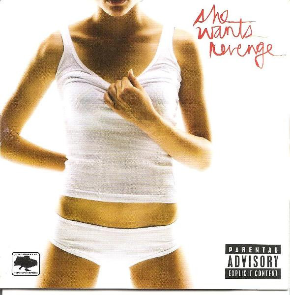 She Wants Revenge album cover. It features a scantily clad woman wearing a white undershirt and white underwear against a white background. Her right hand is behind her back and her left hand is over her chest, lightly pulling down at her collar. The image is cropped so that you can't see her face, only her lower lips and below. You can only see a portion of her upper legs as well. "she wants revenge" is written in red cursive lettering in the top right corner. On the bottom right corner is "PARENTAL ADVISORY EXPLICIT CONTENT"