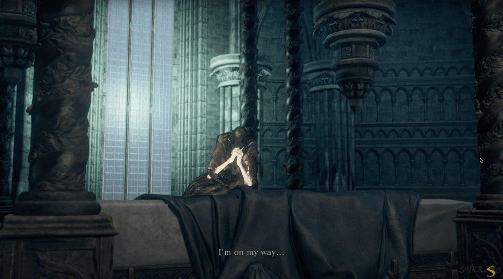 Lothric holds his hands together in what looks like a prayer while saying, "I'm on my way..."