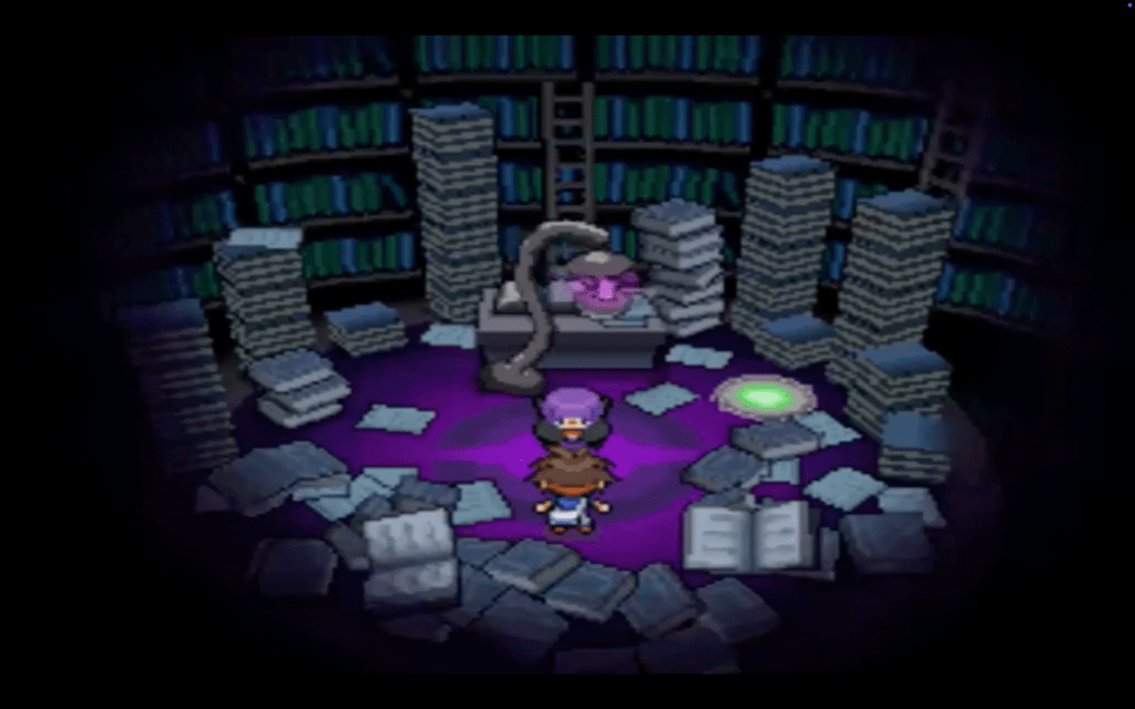 Shauntal is surrounded by piles of books and a spooky lamp.