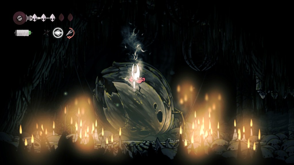 Hornet stabs her needle sword thing into a large dead bug in a dimly root room with skulls all over the ground.